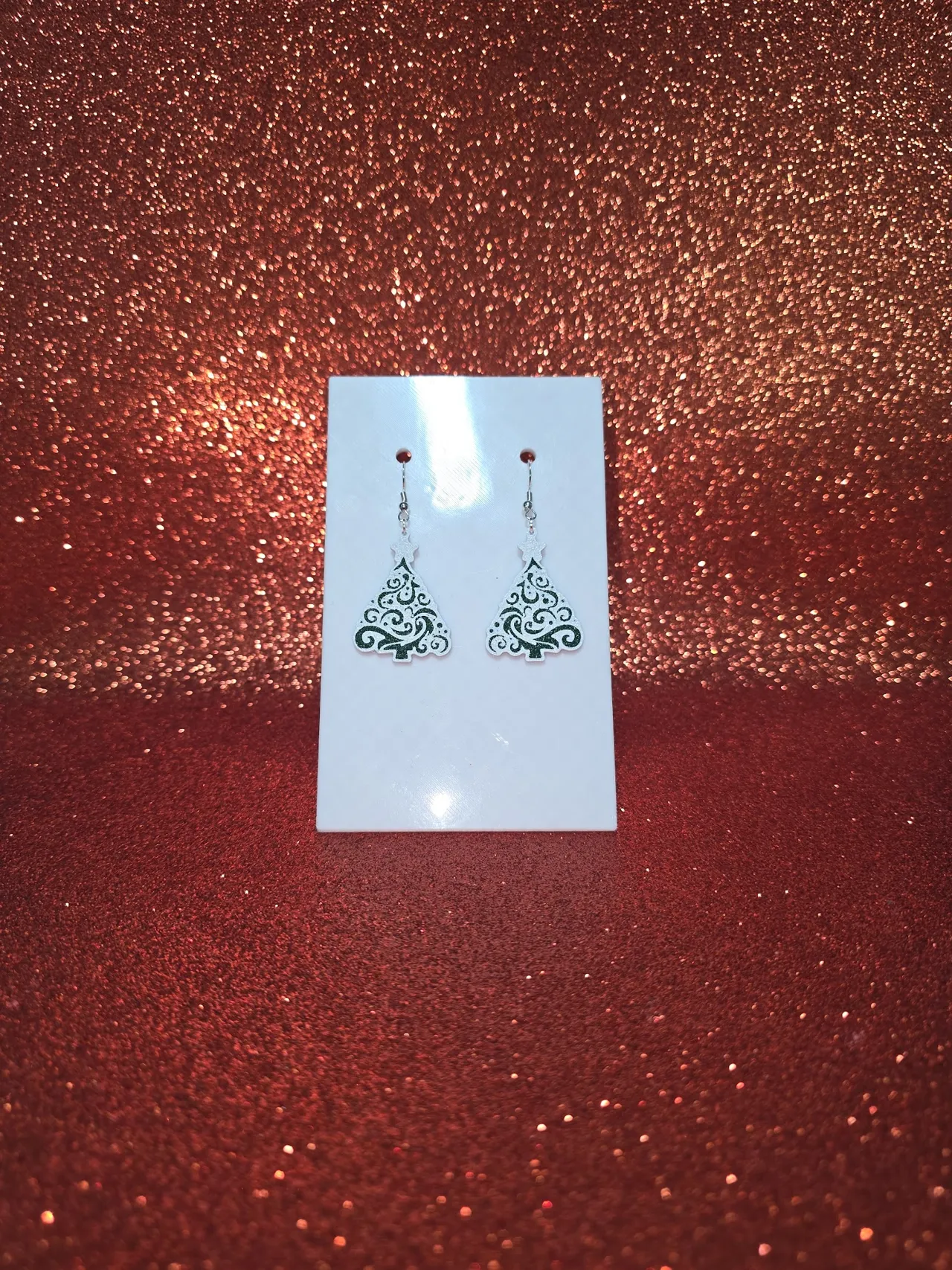 Snow-covered Christmas tree earrings view 2