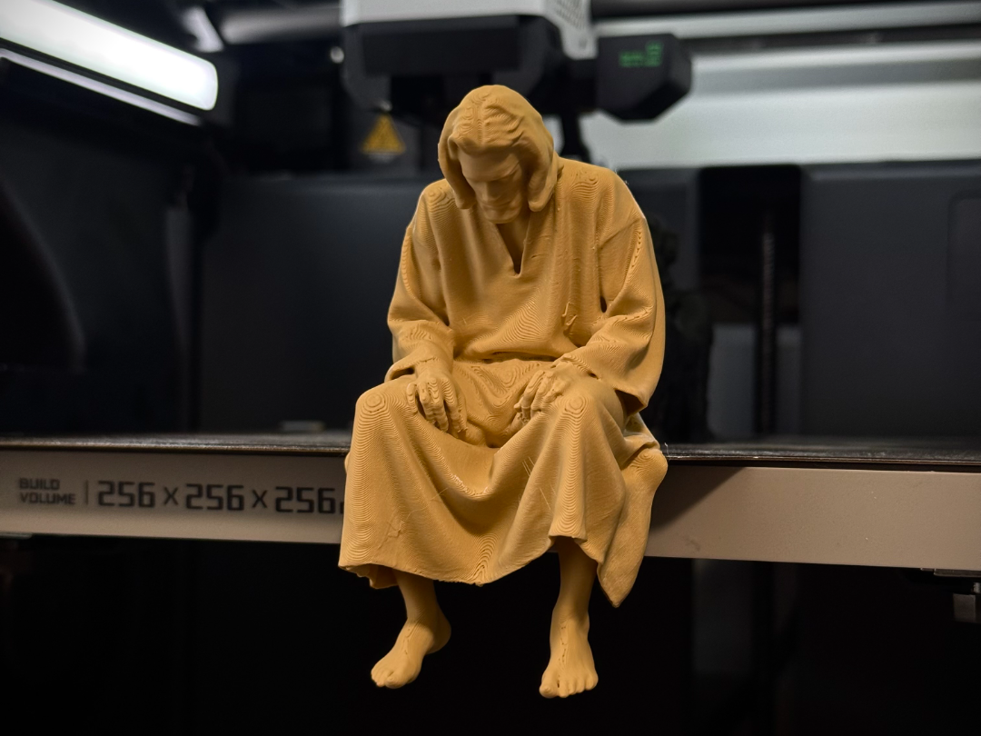 Sad Jesus Figurine sitting on a ledge!