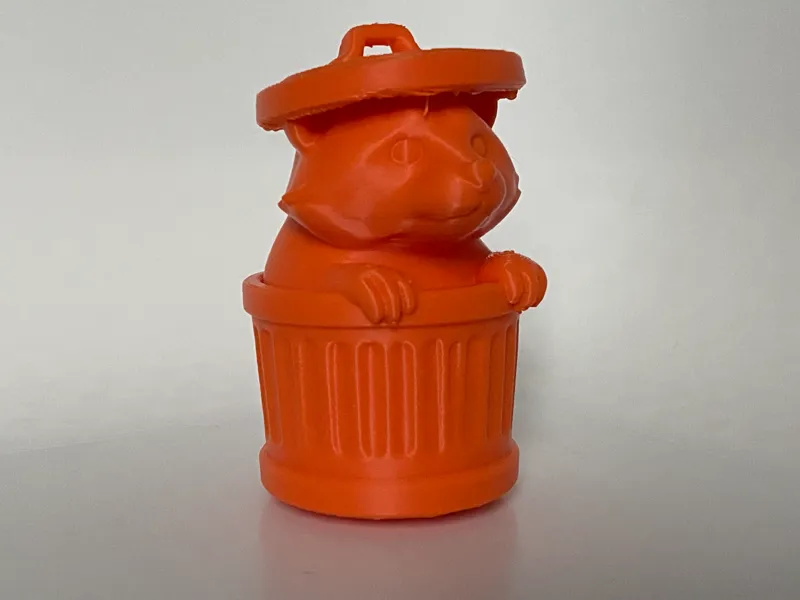 Raccoon in a bin