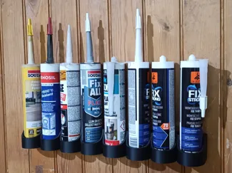 Caulk gun cartridge holder