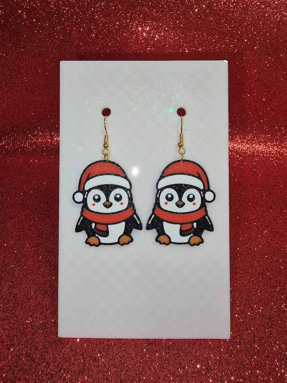 Christmas penguin earrings view 2