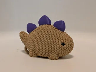 Cute knitted baby Stegosaurus dinosaur