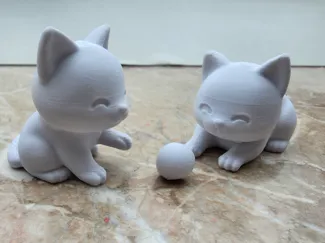 2 Cute Cats playing with a ball