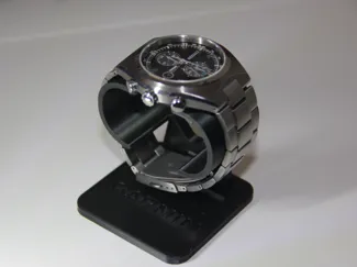 Watch stand with an integrated tray