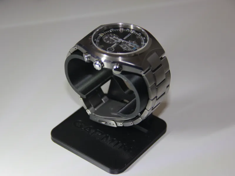 Watch stand with an integrated tray