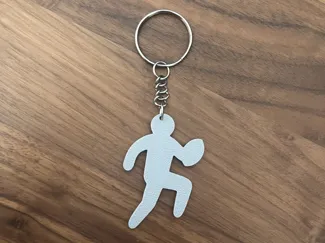 Running rugby player keychain
