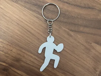 Running rugby player keychain