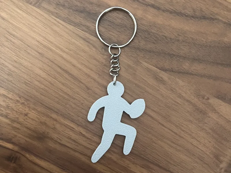 Running rugby player keychain
