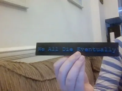 "We All Die Eventually!" Plaque