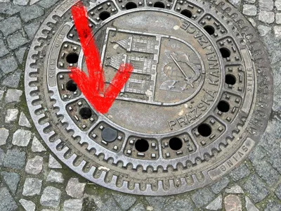 Geocache PET holder in Manhole cover