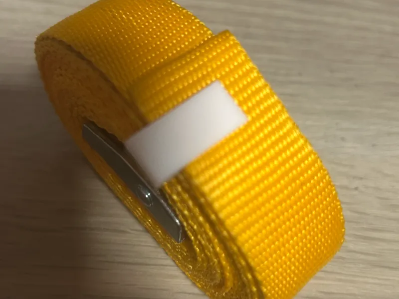 attache sangle enroulé