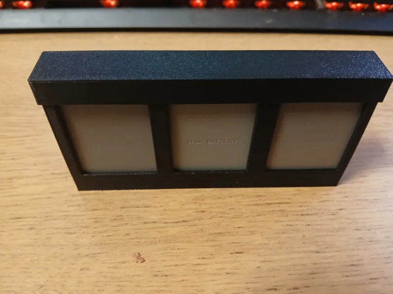 Olympus battery holder