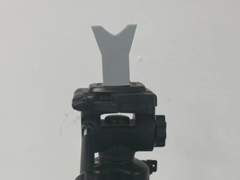 Gun rest for camera tripod