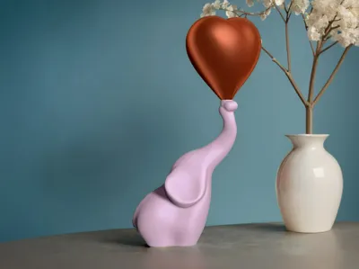 Elephant with heart balloon 