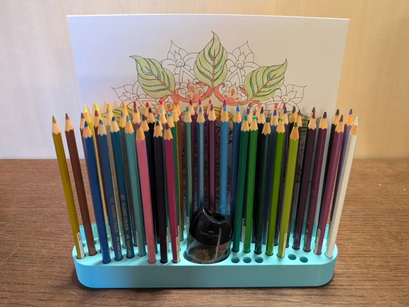 Holder for 68 pencils, sharpener + sheets of paper
