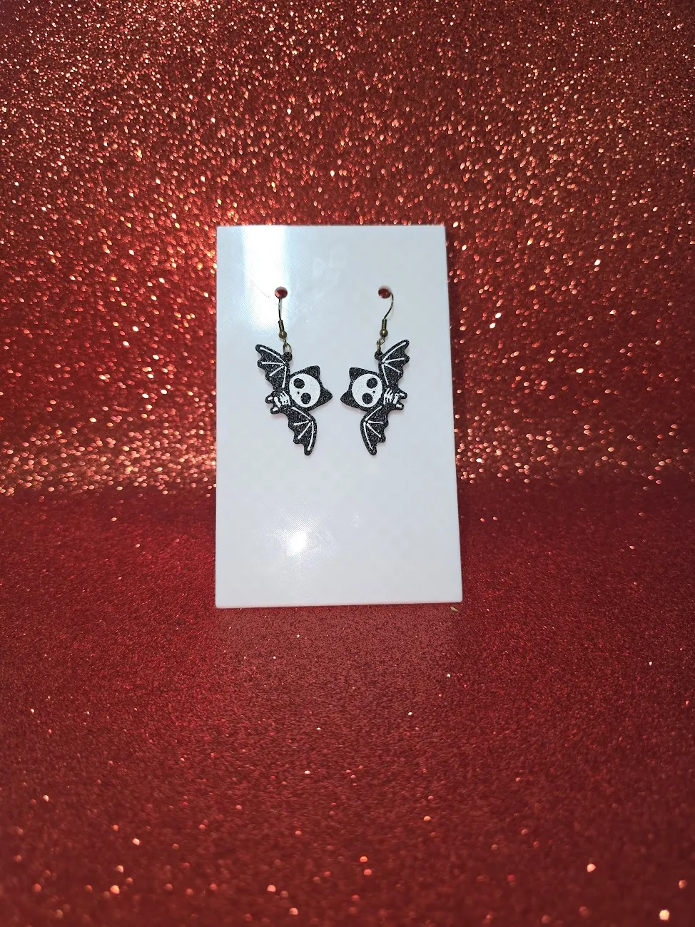 Skeletal bat earrings view 2
