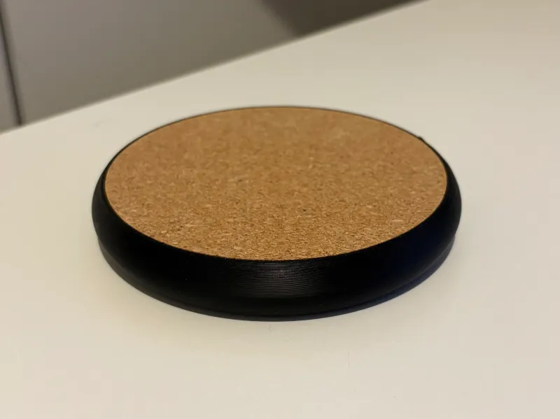 Coaster with integrated bottle opener