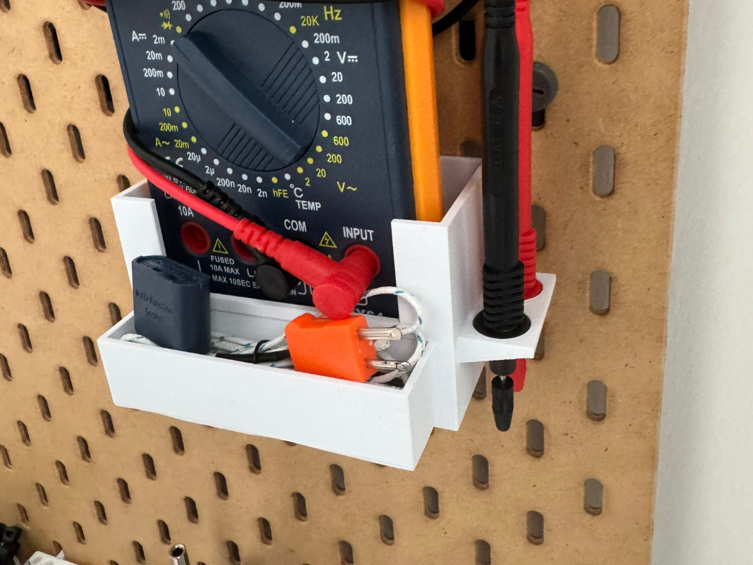 Skadis multimeter holder for a larger multimeter