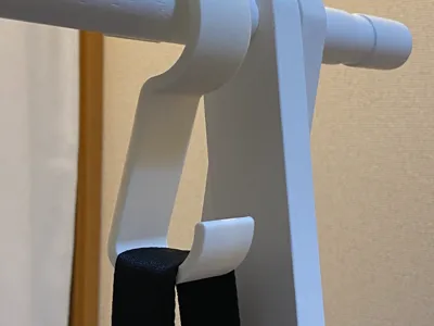 Hook for hanging wide shoulder straps of bags on a bar