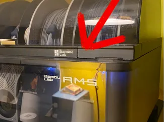 Spacer for AMS cover