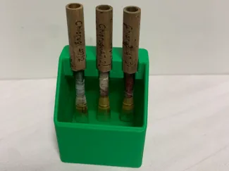 Humidifying cube with oboe reed holder