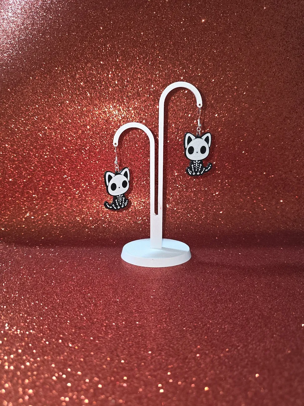 Cat skeleton earrings view 3