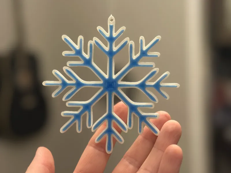 Snowflake christmas tree decor with blue accent
