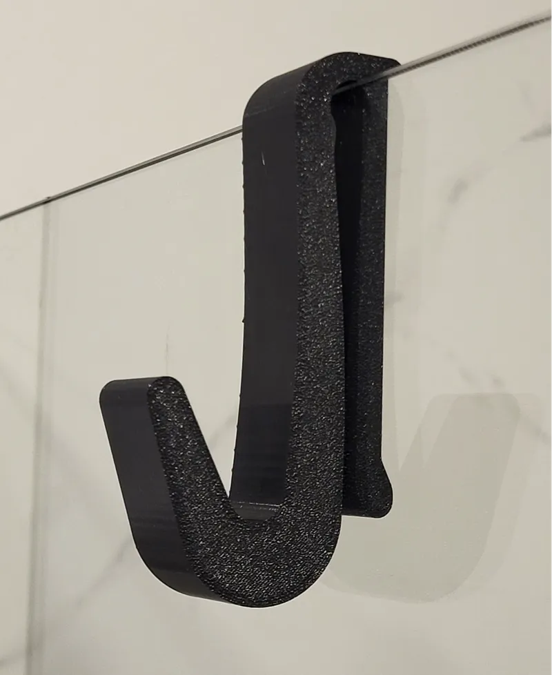Towel hanger for shower cabin
