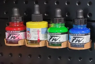 Pegboard paint rack for Daler and Rowney paints.