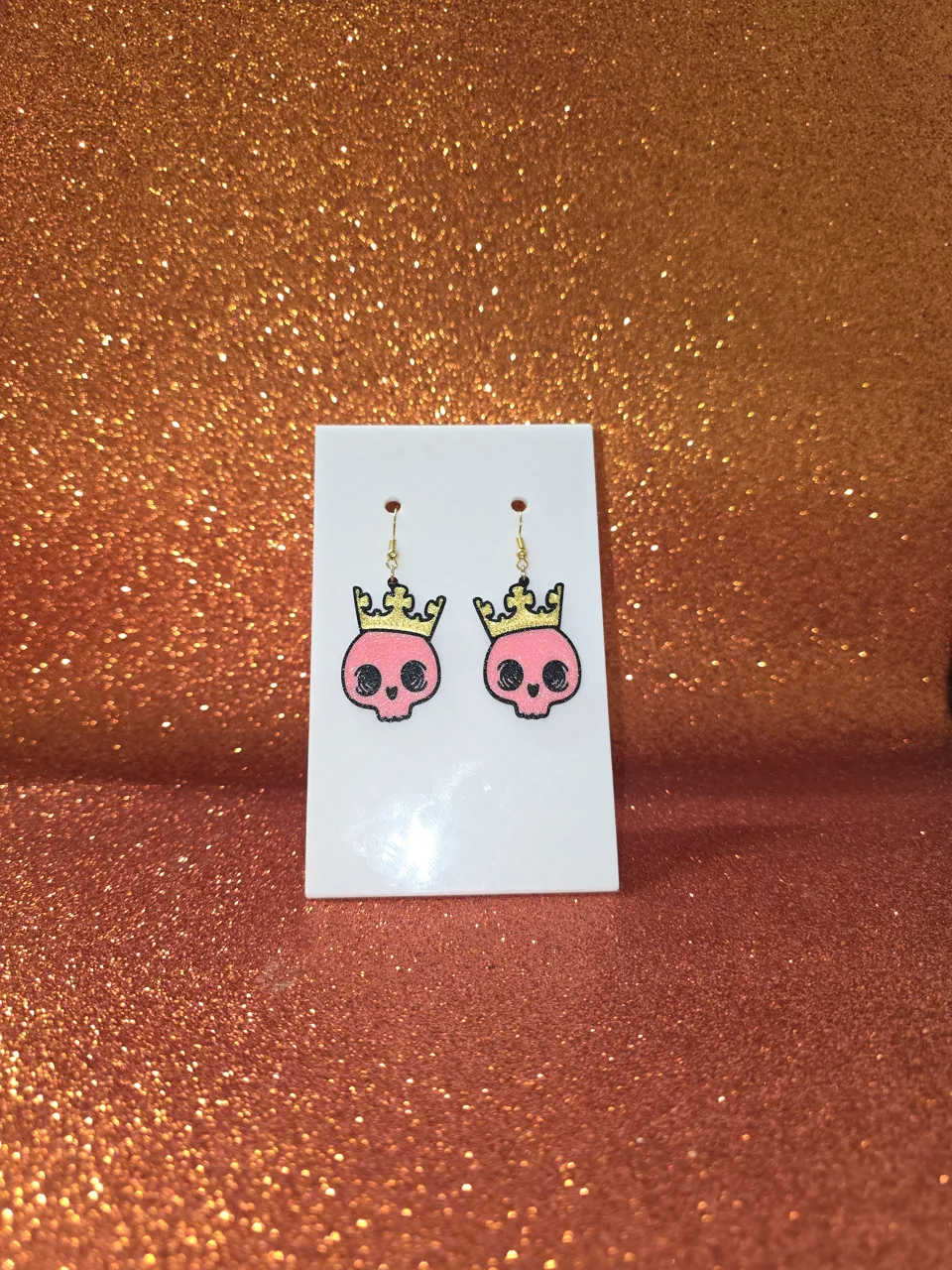 Baby king skull earrings view 2