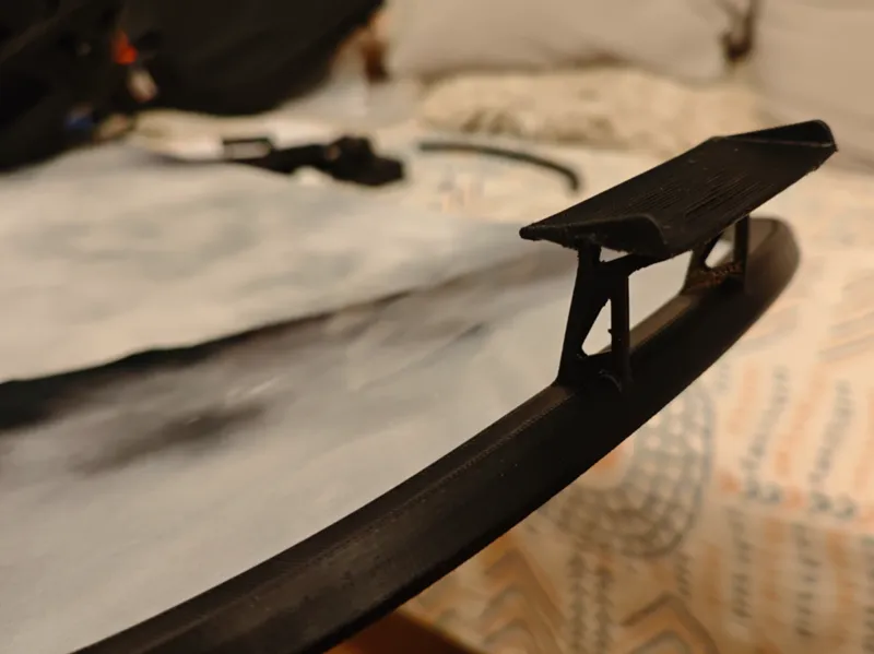 Snowboard bumper with spoiler (rear protection)