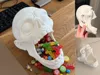 Added weight in chin for use as candy bowl
