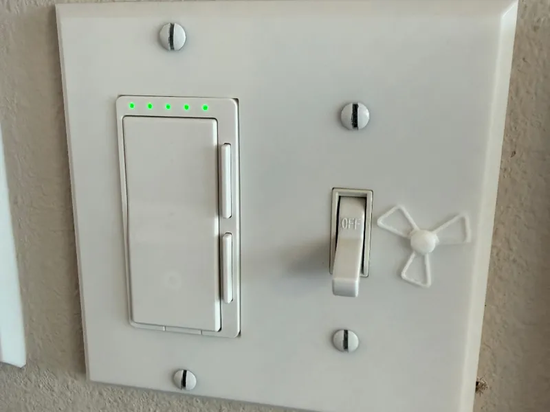 Rocker and toggle switch with fan emblem