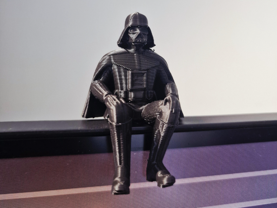 Proud Darth Vader Sitting on a ledge