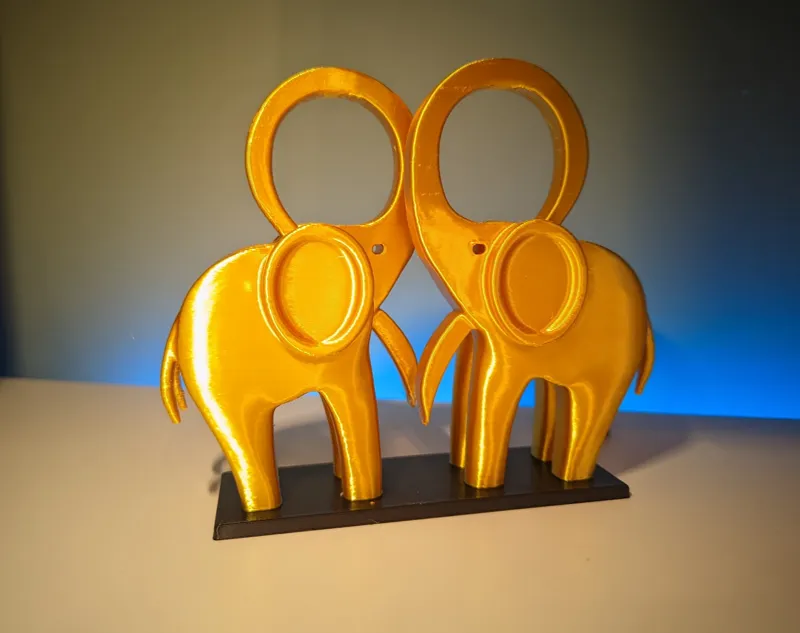 Loving elephants create heart minimalist sculpture