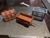 10% bigger to allow miniatures to fit in the wagon and cage.