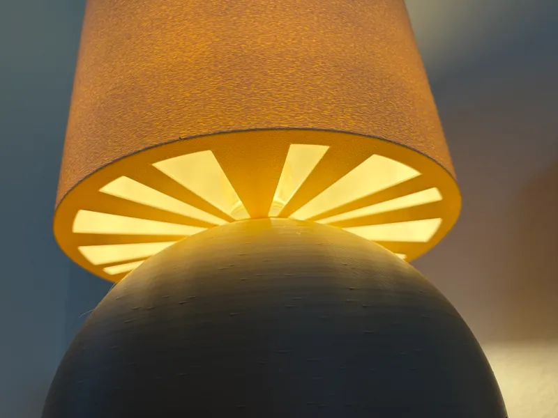 Half capsule lamp with sunburst shadow lampshade