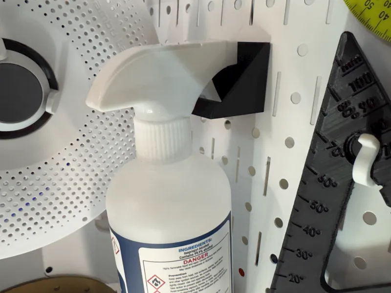 Pegboard spray bottle holder