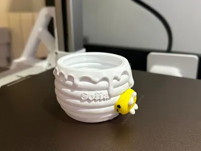 Honey jar with bee 