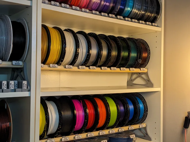 Broom handle spool shelf