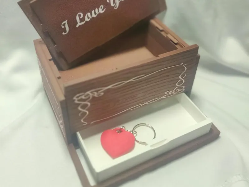 Wood jewellery box with secret compartment