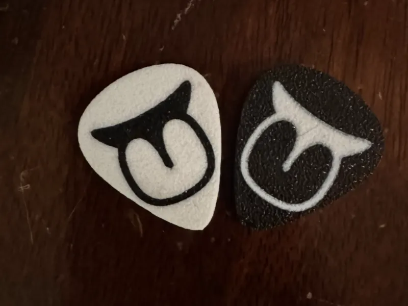 Guitar Pick Sticking Out Tongue 