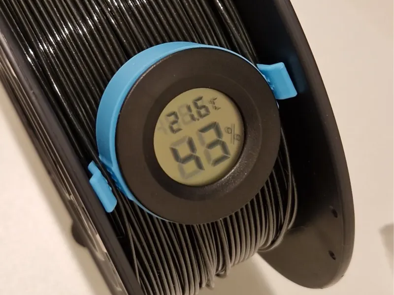 Filament clip with hygrometer mount