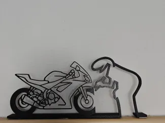 La Linea malt sich ein Motorrad