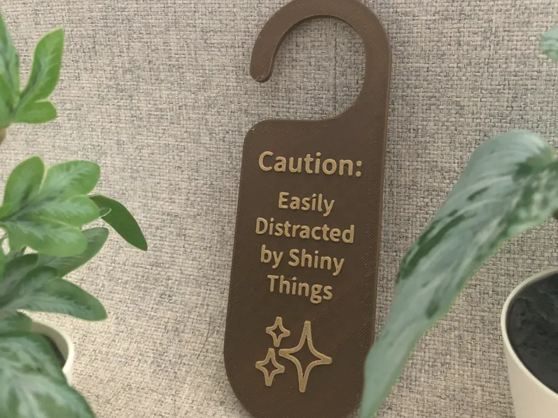 Caution sign – Easily Distracted by Shiny Things