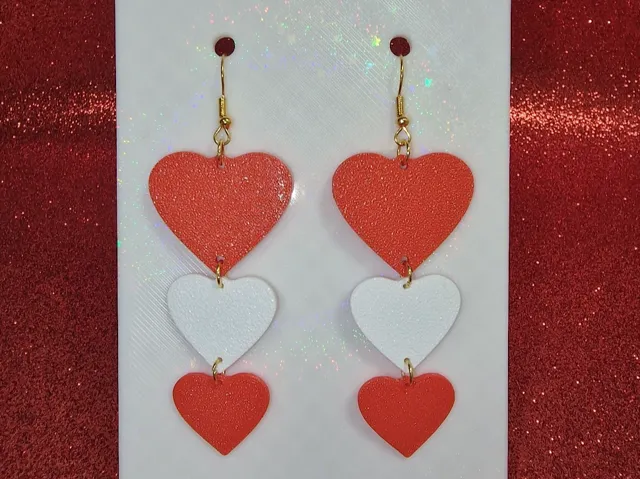Three heart earrings