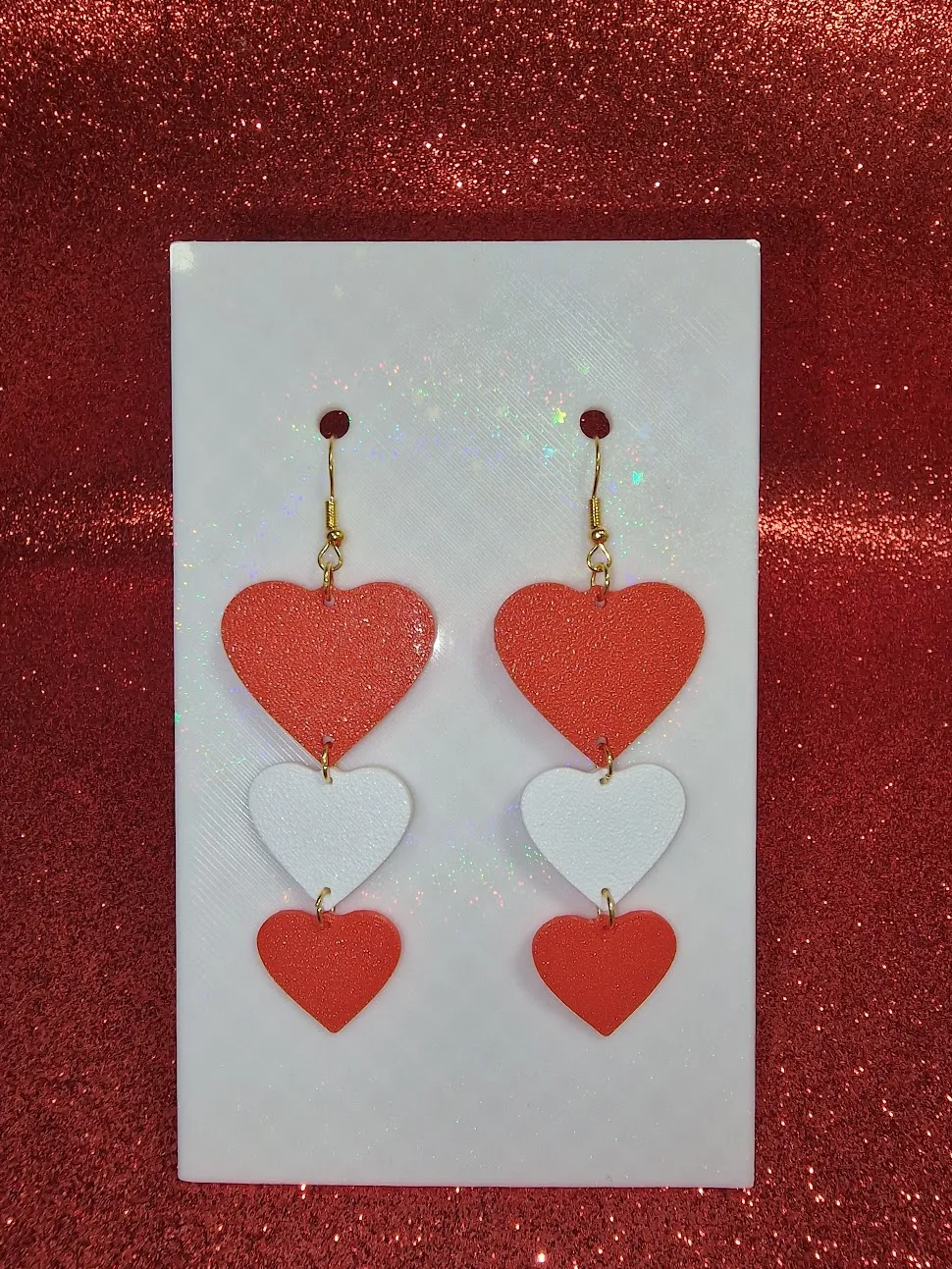 Three heart earrings view 2