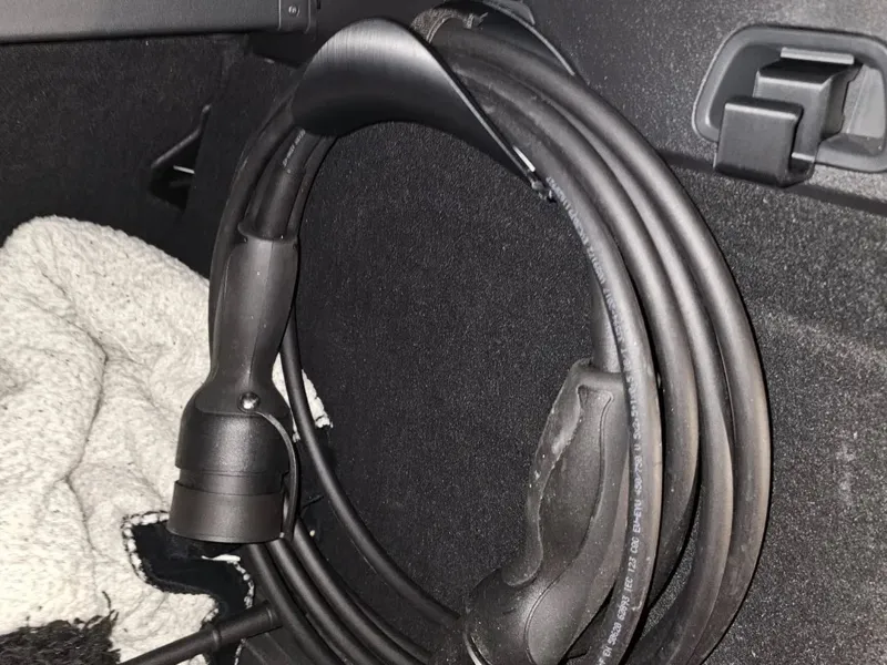 Volvo trunk charging cable holder 