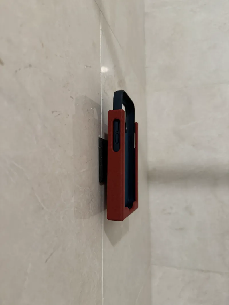 Phone holder that is mountable to the wall 
