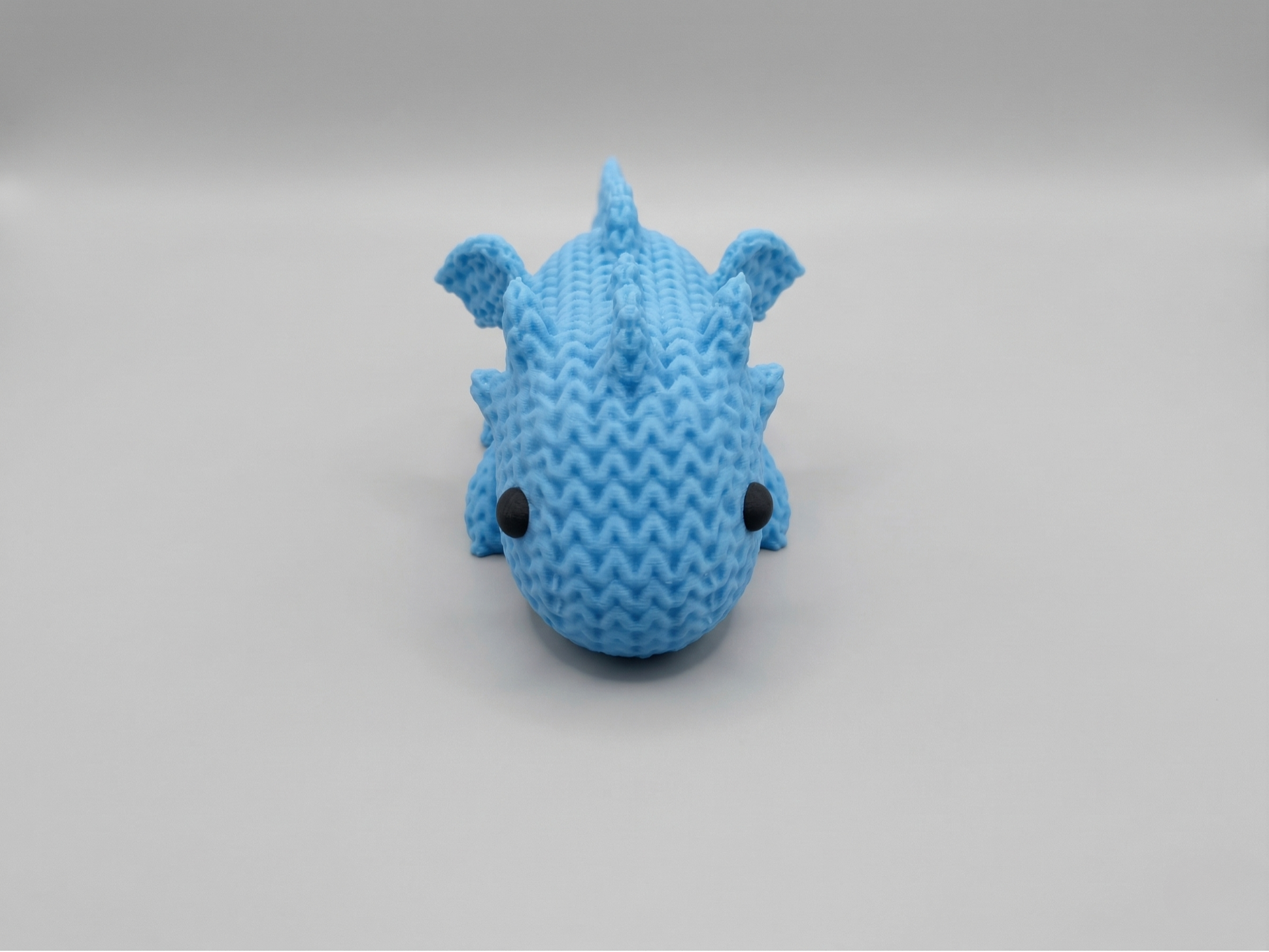 Cute knitted little dragon